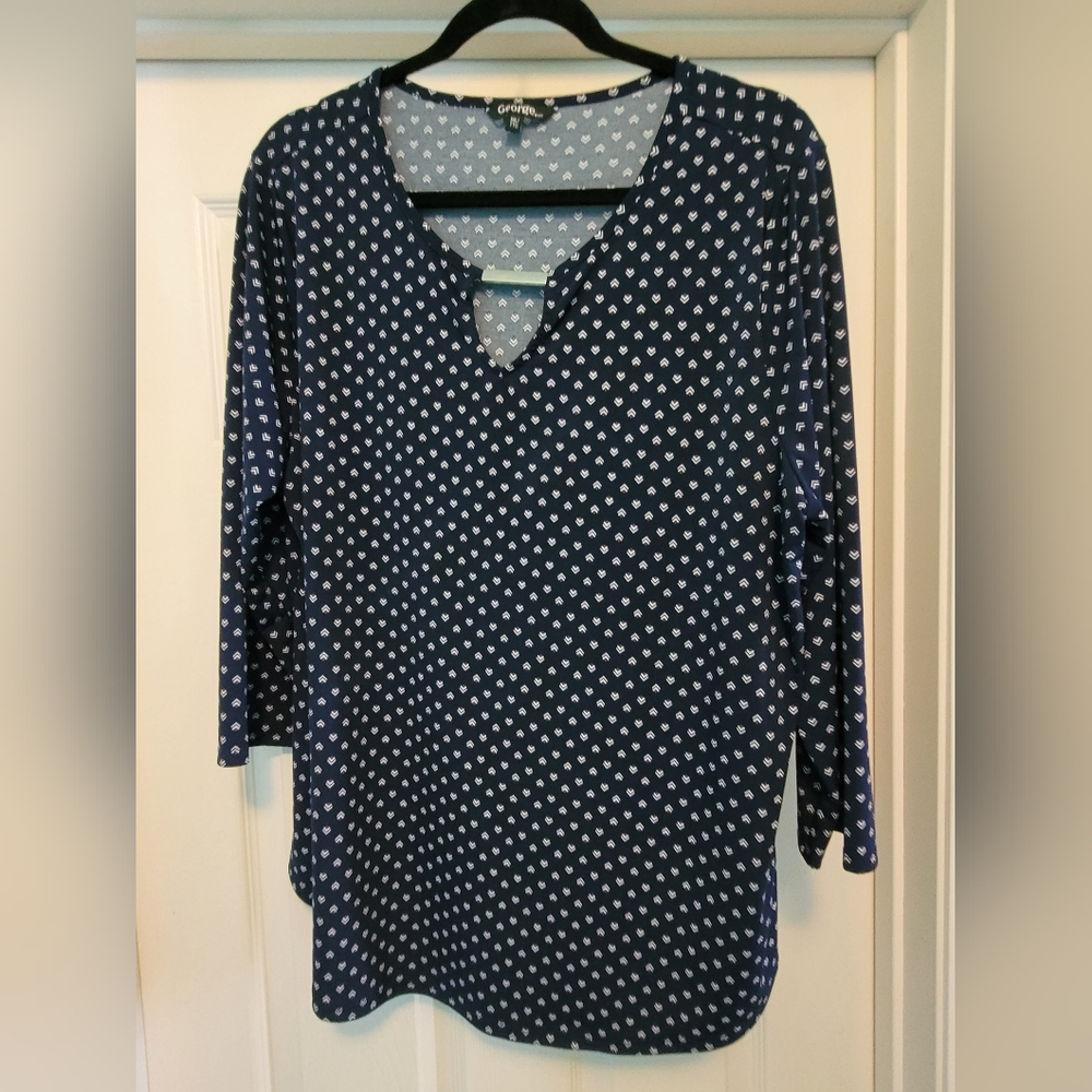 Navy blue with pink and white print blouse with 3/4 length sleeves and cutout